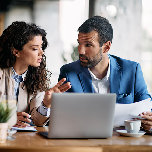 Woman, speaking to her financial advisor about wealth and asset management.